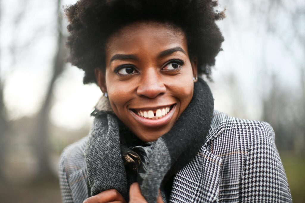 pexels-photo-819105-819105 Portrait of a smiling woman in a scarf outdoors during autumn in Budapest.
