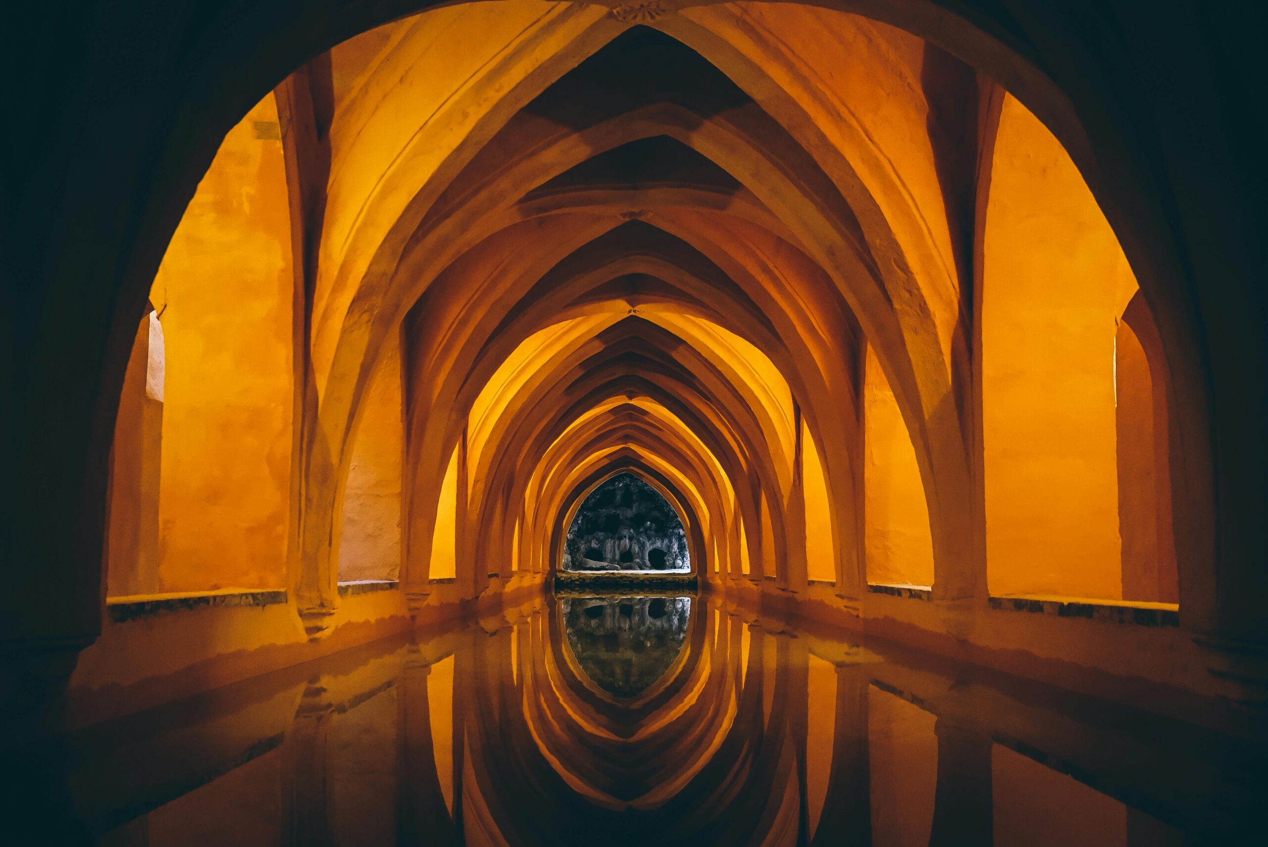 Captivating arches reflected in water create a mesmerizing visual symmetry.